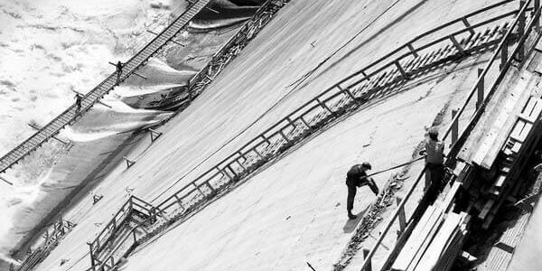TVA man descending dam facade with rope